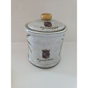 Raymond Waites Decorative Porcelain Palm Tree Crest Canister Jar with Lid